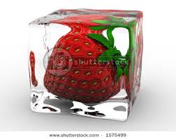 Strawberry frozen in ice cube