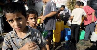 Palestinian children collect water ...