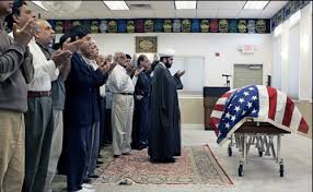 A Muslim Imam leads mourners